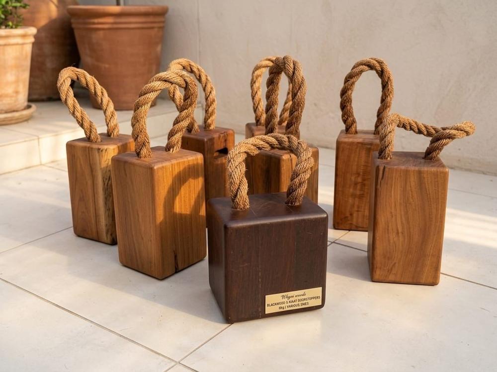 Blackwood and kiaat doorstoppers with rope handles