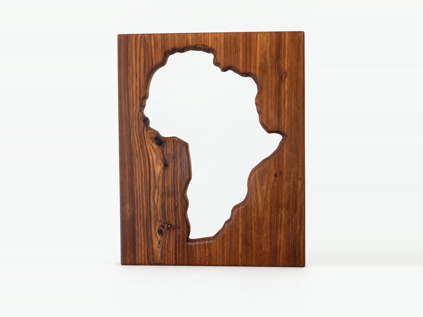 Mirror with a solid kiaat surround, the glass cut to the shape of Africa