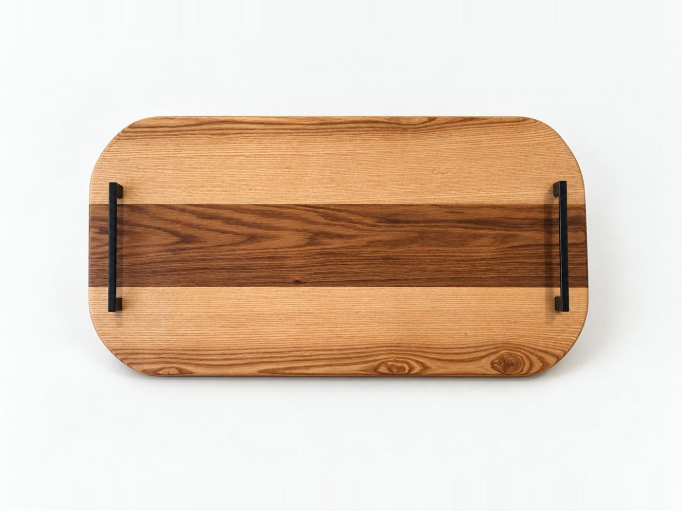 Rectangular ash serving tray with a dark timber stripe and black steel handles